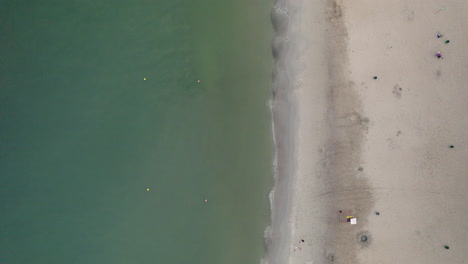 Top-down-aerial-shot-of-an-empty-sandy-beach-in-Gdynia,-Orlowo