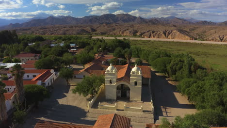 AERIAL---Church-in-a-small-town-in-the-Province-of-Salta,-Argentina,-spinning-shot