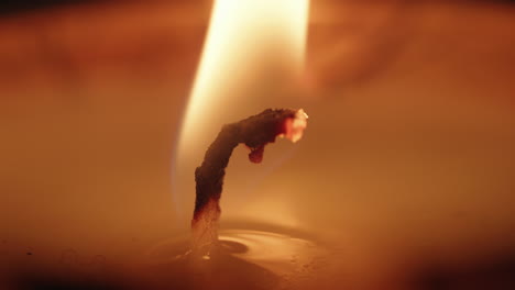 A-macro-shot-of-a-lit-candle-wick-with-a-gentle-flame