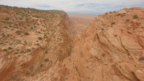 FPV-birdseye-view-of-the-red-sandstone-cliffs-in-Arizona,-Antelope-Pass-Vista