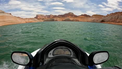 POV-person-jet-skiing-in-red-canyons-of-Lake-Powell-in-Utah