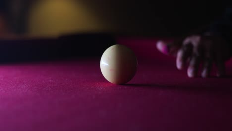 Man-ready-himself-and-hits-the-cue-ball-on-the-pool-table