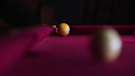 Cue-ball-hits-solid-ball-into-the-hole