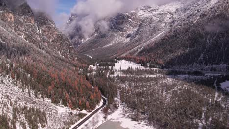 Above-Lago-di-Landro-Dürrensee-frozen-in-winter-valley,-Dolomites-Italy