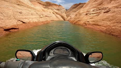 POV-of-a-person-jet-skiing-through-red-canyon-slots-on-Lake-Powell