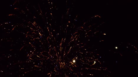 Close-aerial-footage-of-fireworks-being-shot-into-the-sky