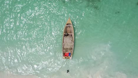 Overhead-View-Of-Fisherman-And-Fishing-Boat-At-Pedernales-Beach-In-Dominican-Republic