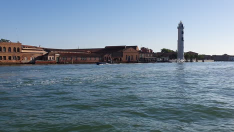 Venice-from-a-boat-island-with-lighthouse-with-splash-HD-30-frames-per-sec-7-sec