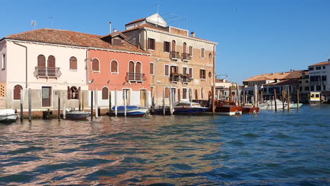 Venice-from-a-boat-island-with-several-buildings-with-splash-HD-30-frames-per-sec-8-sec