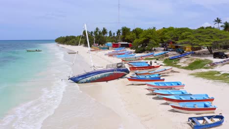 Wooden-Fishing-Boats-Lined-In-The-Shoreline-Of-Pedernales-Beach-In-Dominican-Republic