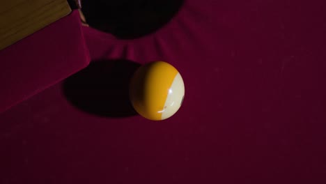 Slow-motion-Cue-ball-hits-striped-ball-into-hole-on-the-pool-table