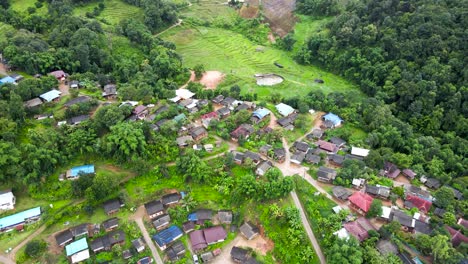 Aerial-Flying-Over-Karen-Tribe-Village-In-Chiang-Mai-And-Terrace-Farms-On-Hillside