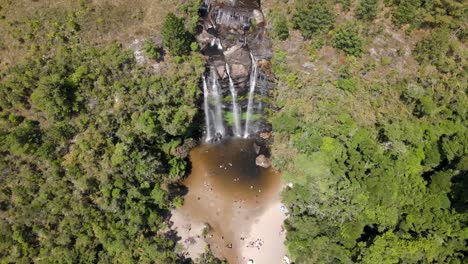 Aerial-view-of-a-waterfall-river-and-people-cooling-off-in-the-summer