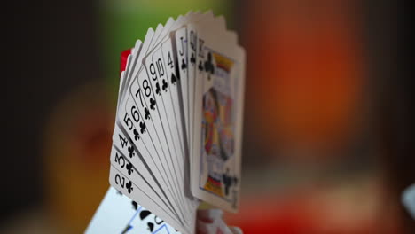 One-hand-hold-the-cards-for-playing-cards-game-in-cruise-winning-poker