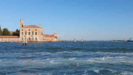 Venice-from-a-boat-island-with-renaissance-building-HD-30-frames-per-sec-5-sec