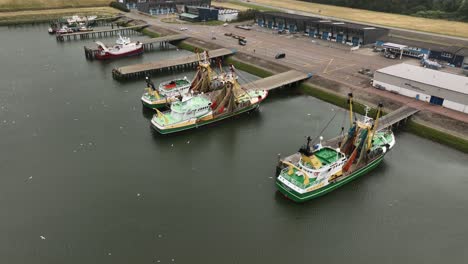 Aerial-Drone-Shot-of-Fishing-Boats-Docked-at-the-Sea-Lock-at-Stellendam