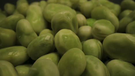 Green-Fresh-Ripe-Broad-Beans,-Legume-Leguminous-and-Fava-Bean-Vegetables,-Macro-Close-Up-Probe-Lens-Studio-Shot,-Panning-Tracking-Sideways-View-of-Agricultural-Product