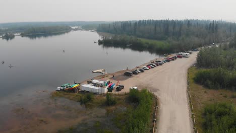 4K-Drone-Video-of-Paddle-Boarders-and-Kayakers-on-Cushman-Lake-in-Fairbanks,-AK-during-Summer-Day