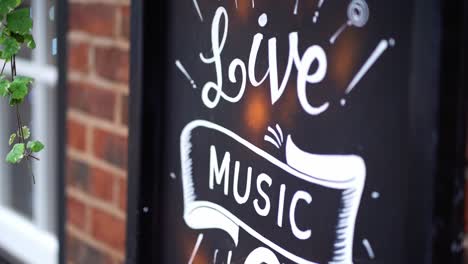 A-sign-outside-of-a-pub-promoting-Live-Music
