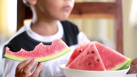 Little-boy-eating-sweet-red-watermelon-stock-footage-1