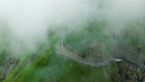 Car-Driving-Through-Abano-Mountain-Pass-Shrouded-By-Clouds-In-Georgia