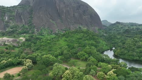 AERIAL---Zuma-Rock-monolith,-Abuja,-Nigeria,-reverse-tilt-down-reveal