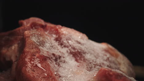 Defrosted-Fresh-Uncooked-Raw-Red-Icy-Meat,-Splashing-Water-on-it,-Close-Up-Dolly-Macro-Probe-Lens-Studio-Shot,-Culinary-Raw-Food-Thawed-Product