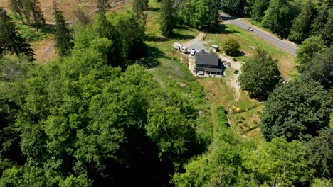 Orbiting-aerial-view-of-a-private-house-in-America-surrounded-by-nature