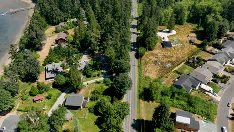 Overhead-aerial-shot-of-the-main-road-leading-through-Freeland-Washington's-suburban-neighborhoods