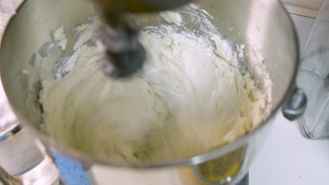 A-static-shot-of-butter-cream-frosting-being-whipped-up