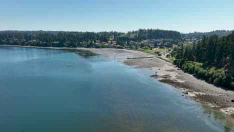 Drone-view-of-Whidbey-Island's-shoreline-on-a-warm-summer-day