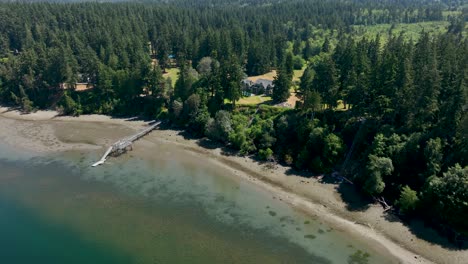 Drone-shot-pulling-away-from-a-private-estate-off-of-Whidbey-Island's-beautiful-coast