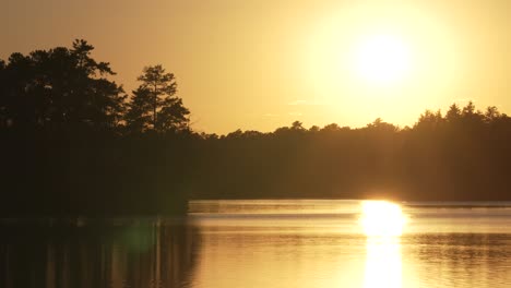 Beautiful-And-Dramatic-Sunset-Reflected-In-Atsion-Lake,-New-Jersey,-USA