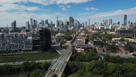 4K-drone-shot-over-Toronto's-east-side,-with-the-downtown-skyline-in-the-background