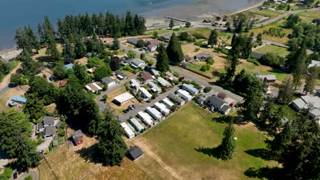 High-up-aerial-view-of-mobile-home-park-near-the-ocean-in-Freeland,-WA