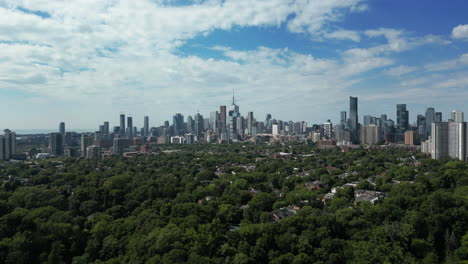 4K-drone-shot-over-Toronto's-east-side,-with-the-downtown-core-in-the-background,-looking-southwest