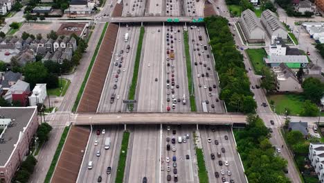 Traffic-on-busy-freeways-of-sunny-Houston,-Texas,-United-states---Aerial-overlook