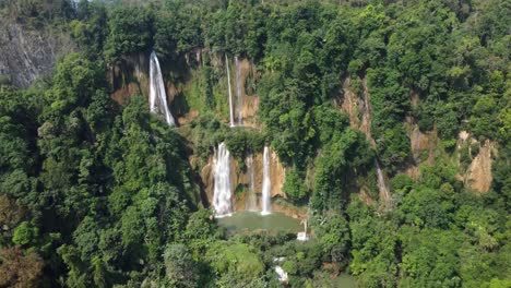 A-rotational-drone-shot-of-Thi-Lo-Su-Waterfall,-located-off-the-beaten-track-in-the-backpacker-country-of-Thailand-in-the-area-of-Umphang-in-the-continent-of-Asia