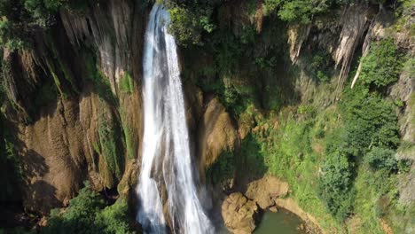 Close-up-drone-shot-of-Thi-Lo-Su-Waterfall,-off-the-beaten-track-in-the-jungle-of-North-Thailand-in-the-area-of-Umphang-in-SE-Asia
