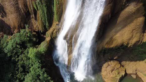 Close-up-drone-shot-of-the-button-of-one-of-the-huge-waterfalls-of-Thi-Lo-Su-Waterfall,-located-off-the-beaten-track-in-the-backpacker's-paradise-of-North-Thailand-in-the-area-of-Umphang
