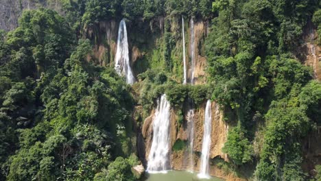 A-gorgeous-4K-drone-shot,-flying-toward-Thi-Lo-Su-Waterfall-in-the-outstanding-jungle-of-Umphang,-located-in-the-country-of-Thailand-in-Southeast-Asia