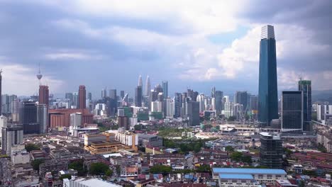 Drone-shots-of-Kuala-Lumpur-city-skyline-with-skyscrapers,-Malaysia,-UHD