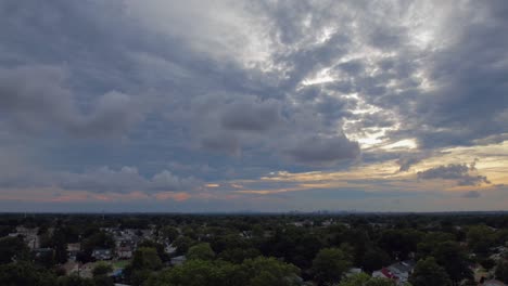 An-aerial-time-lapse-over-a-residential-neighborhood-on-Long-Island,-NY-which-was-filmed-on-a-cloudy-day-at-sunset