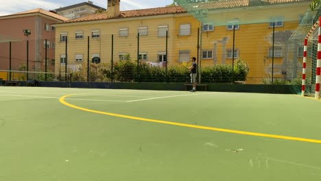 Low-section-of-man-playing-professional-tennis-on-sunny-court