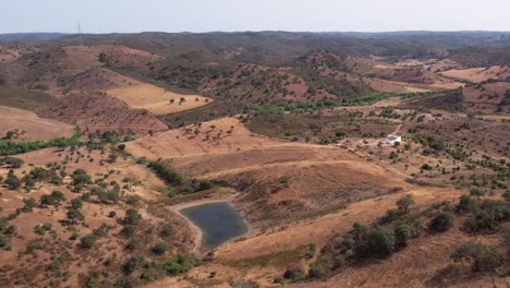 Aerial-Panorama-Of-Vast-Rural-Landscape-With-Small-Lake-In-Alentejo,-Portugal