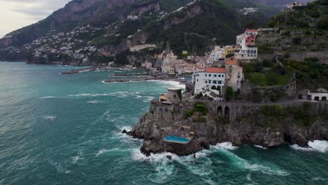Luxury-house-and-pool-in-cliff-on-Amalfi-coast,-Italy,-famous-travel-destination