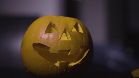 Person-Lit-The-Candle-Inside-The-Carved-Pumpkin