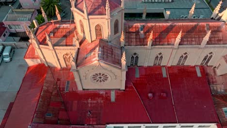 Tilt-up-aerial-view-of-a-gothic-style-church,-Carmelitas-Church-in-Vina-del-Mar,-Chile