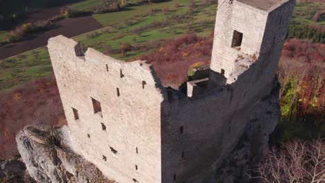 Close-up-of-old-Reussenstein-castle-fort-on-top-of-high-hill,-aerial