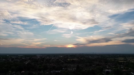 An-aerial-drone-Hyperlapse-of-a-sunset-sky-with-planes-flying-overhead-and-scarring-the-sky-with-their-Vapor-trails